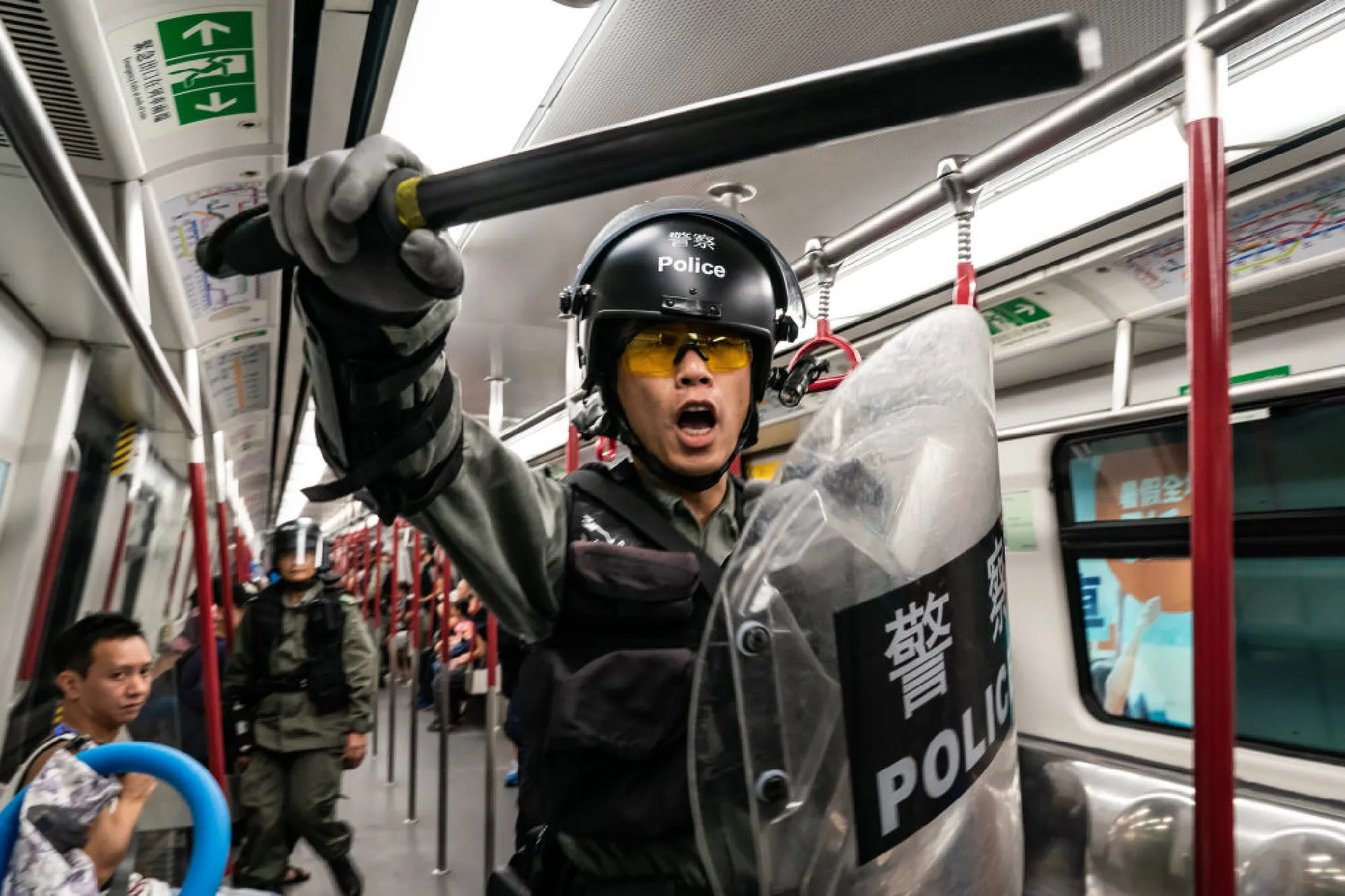 HONG KONG, CHINA - SEPTEMBER 1: Riot police charge in a train at the Tung Chung MTR station after protesters block the transport routes to the Hong Kong International Airport on September 1, 2019 in Hong Kong, China. (Photo by Chris McGrath/Getty Images)