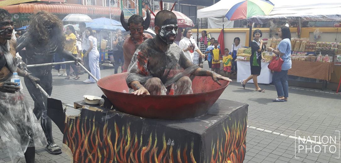 People dressed as ghouls in representation of ancestral ghosts of food donors and local residents