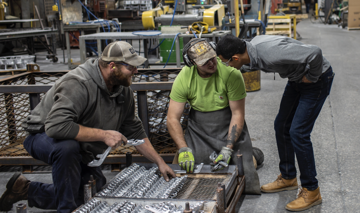 Ryan Seitl, from left, and Tyler Conen listen to CEO Sachin Shivaram at the Wisconsin Aluminum Foundry in Manitowoc, Wisconsin, on Oct. 16, 2019. The company has seen orders collapse during an emerging recession in the manufacturing sector. MUST CREDIT: Photo for The Washington Post by Lianne Milton Photo by: Lianne Milton — The Washington Post Location: Manitowoc United States