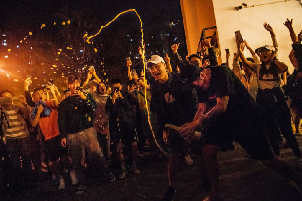 Hong Kong District Council Election  HONG KONG, CHINA - NOVEMBER 25: Local residents celebrate outside a polling station as Junius Ho Kwan-yiu loses in District Council Elections on November 25, 2019 in Hong Kong, China. Hong Kong held its district council elections on Sunday as anti-government protests continue into its sixth month with demands for an independent inquiry into police brutality, the retraction of the word "riot" to describe the rallies, and genuine universal suffrage. (Photo by Billy H.C. Kwok/Getty Images)