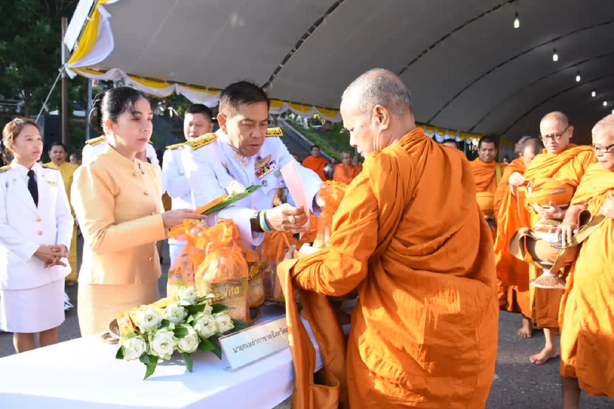 Thais give alms to monks on Father’s Day