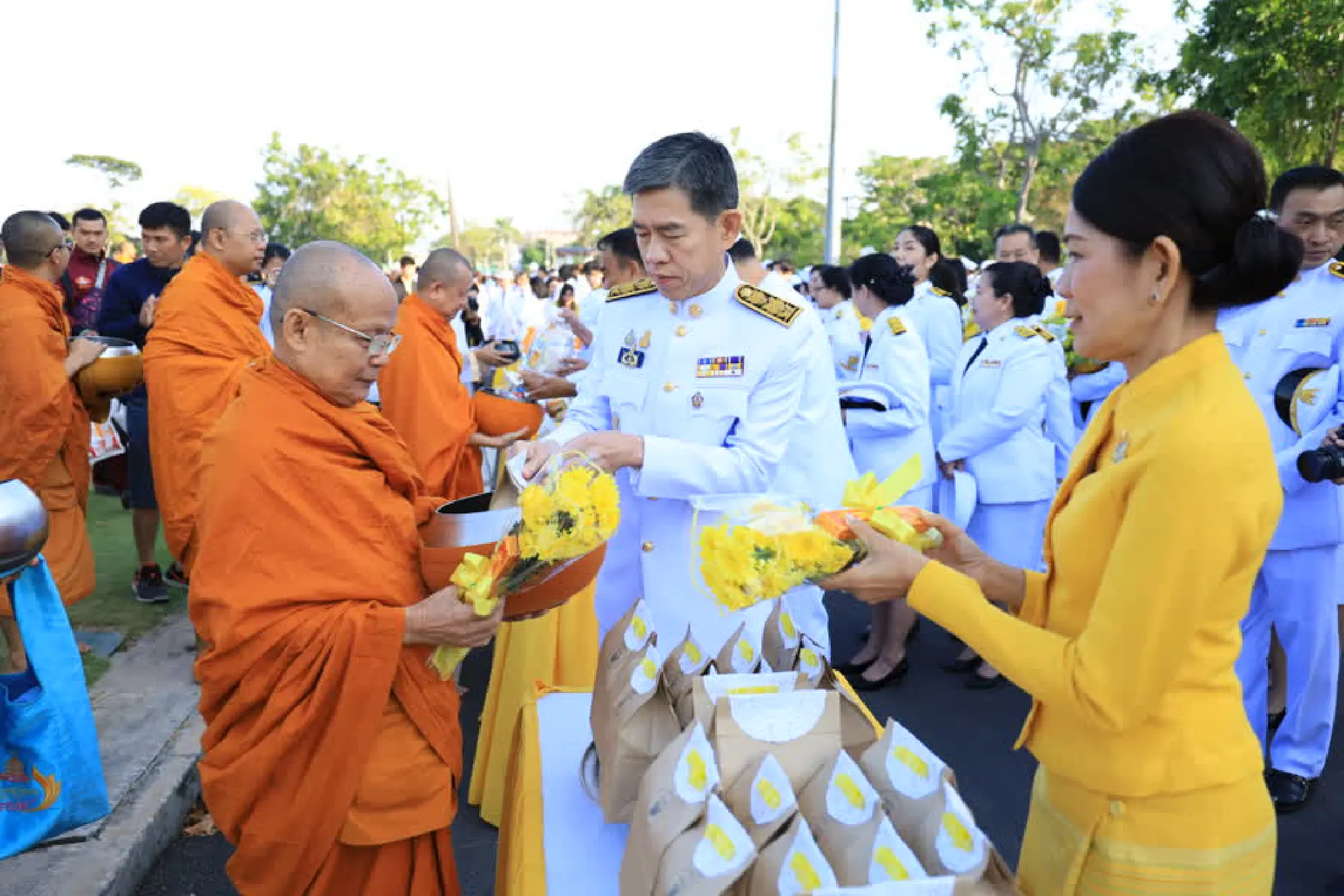Thais give alms to monks on Father’s Day