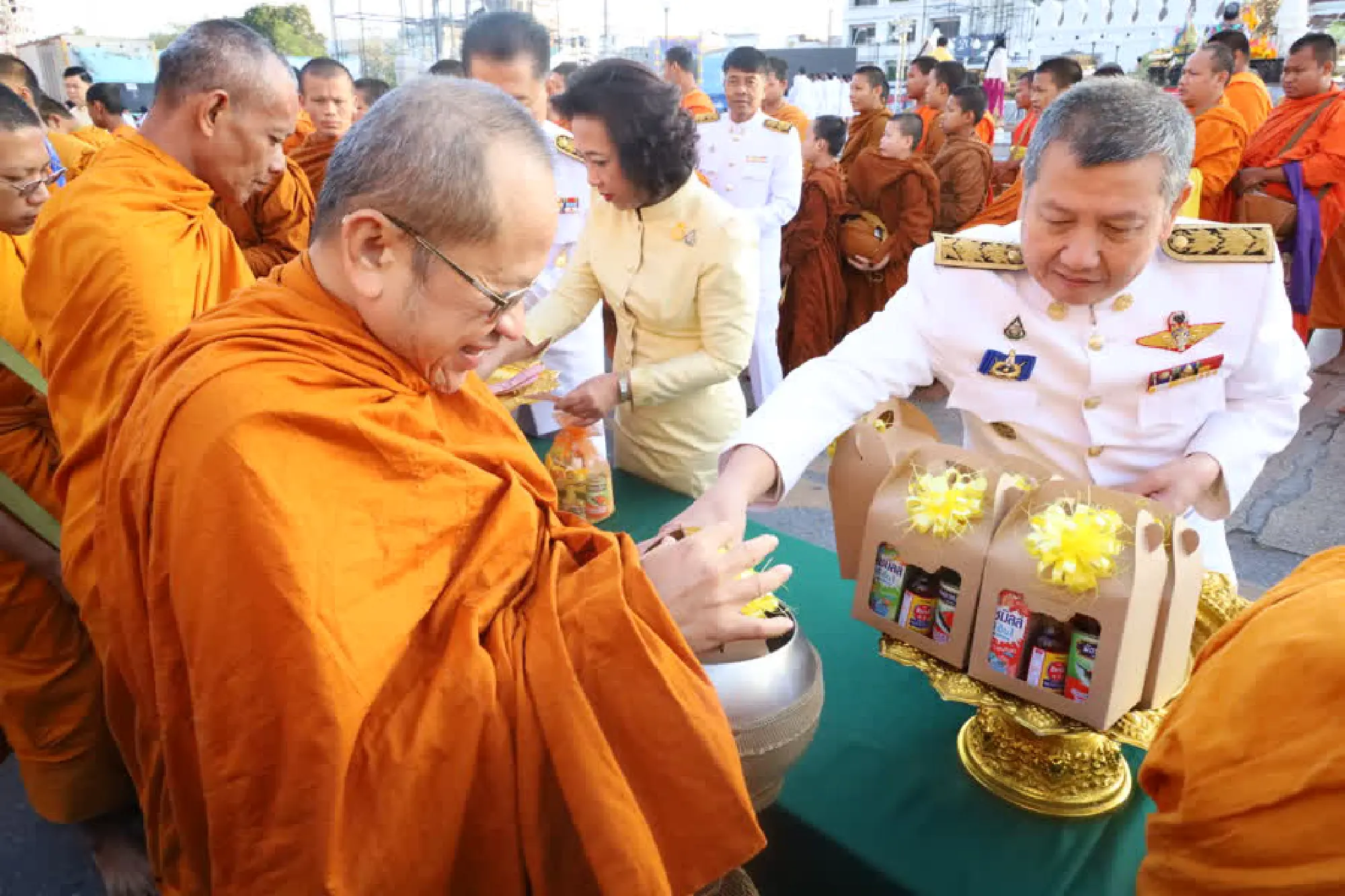 Thais give alms to monks on Father’s Day