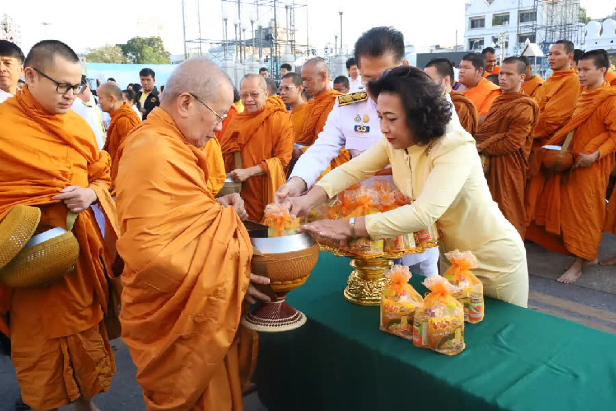 Thais give alms to monks on Father’s Day