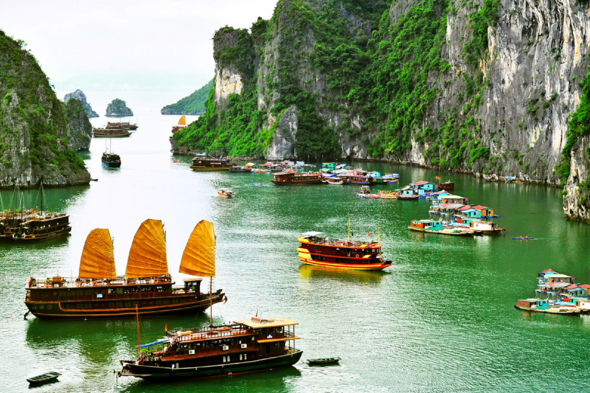 Tourist Junks and Floating village in Ha Long Bay