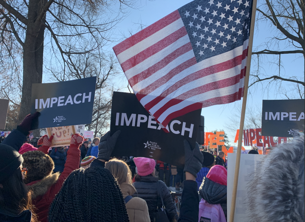 Protesters gather outside the Capitol on Wednesday to call for President Donald Trump's impeachment and removal from office. MUST CREDIT: Washington Post photo by Sarah L. Voisin