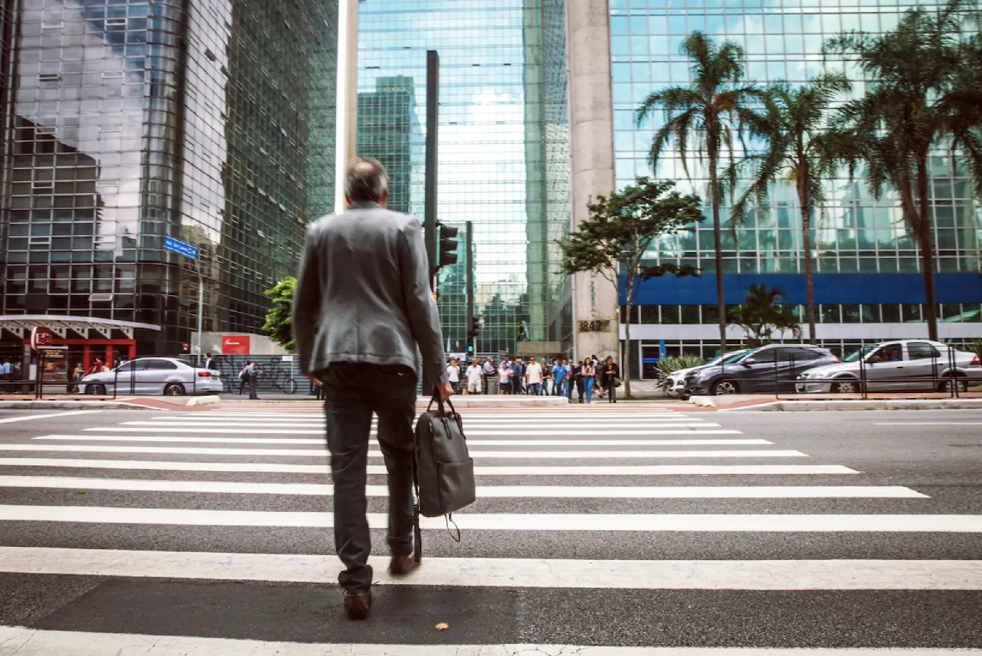 A pedestiran crosses the street in Sao Paulo on Feb. 27, 2018. MUST CREDIT: Bloomberg photo by Jessica Nolte.