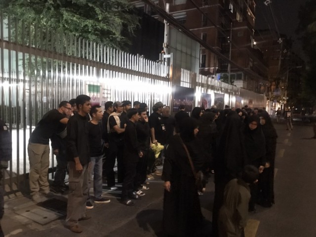 a number of Iranian citizens placed flowers in front of Iran embassy on Sunday.