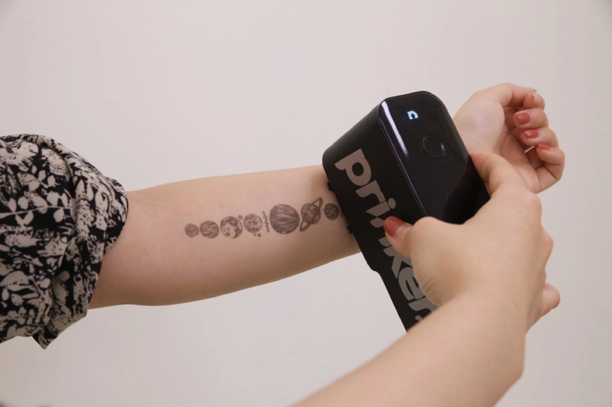 Prinker mobile temporary tattoo printer can instantly print graphics on your skin. MUST CREDIT: Prinker handout photo. 