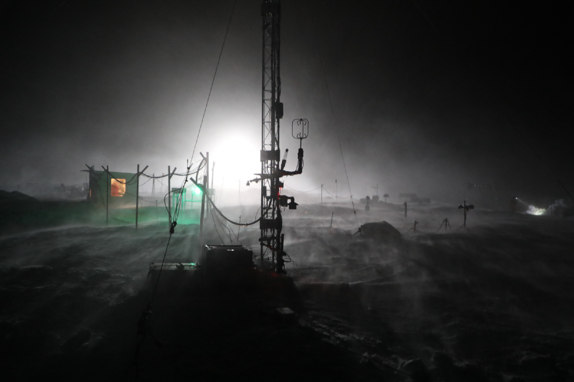 A crack opens up in the ice alongside the research vessel Polarstern. Researchers on the MOSAiC mission are struggling to cope with more fragile and easily fractured ice, a consequence of climate change. MUST CREDIT: Matthew Shupe/Colorado-Boulder/NOAA/CIRES