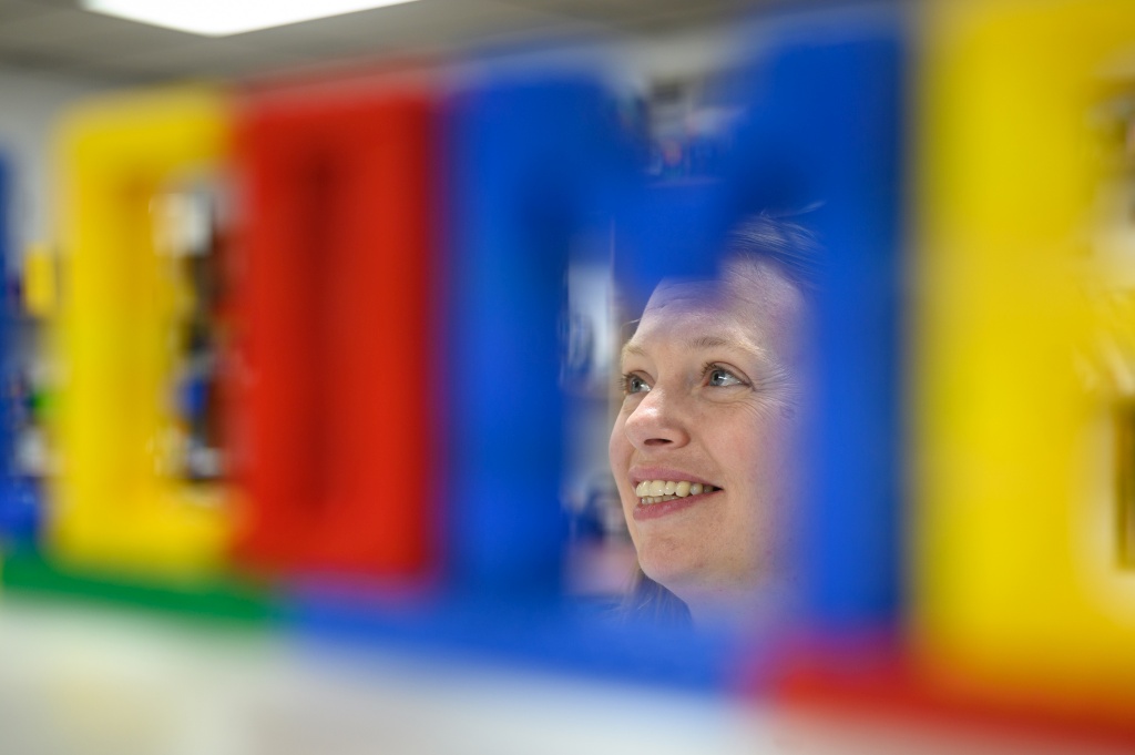 Zach Stephens, 38, of Connellsville, Pa., looks through a pile of Legos during an BYOB adults-only build event at Brooke's Block Party. MUST CREDIT: Photo by Justin Merriman for The Washington Post.
