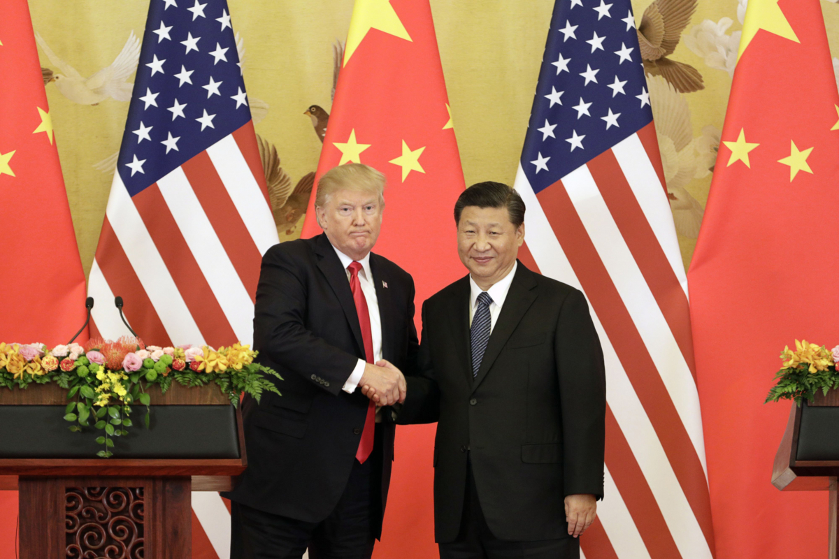File photo of President Donald Trump, left, and Xi Jinping, China's president, shaking hands during a news conference at the Great Hall of the People in Beijing on Nov. 9, 2017. MUST CREDIT: Bloomberg photo by Qilai Shen.