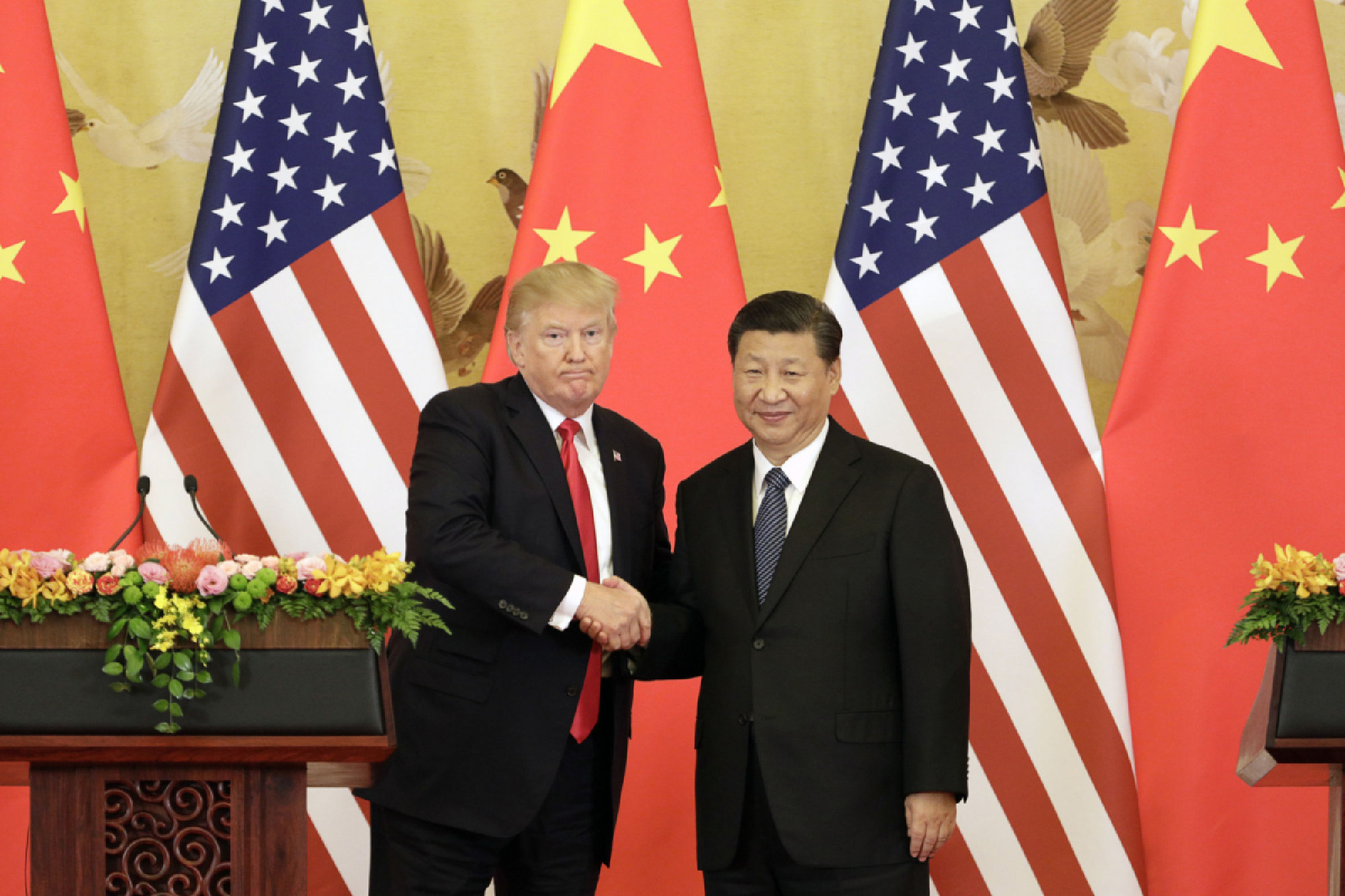 File photo of President Donald Trump, left, and Xi Jinping, China's president, shaking hands during a news conference at the Great Hall of the People in Beijing on Nov. 9, 2017. MUST CREDIT: Bloomberg photo by Qilai Shen.