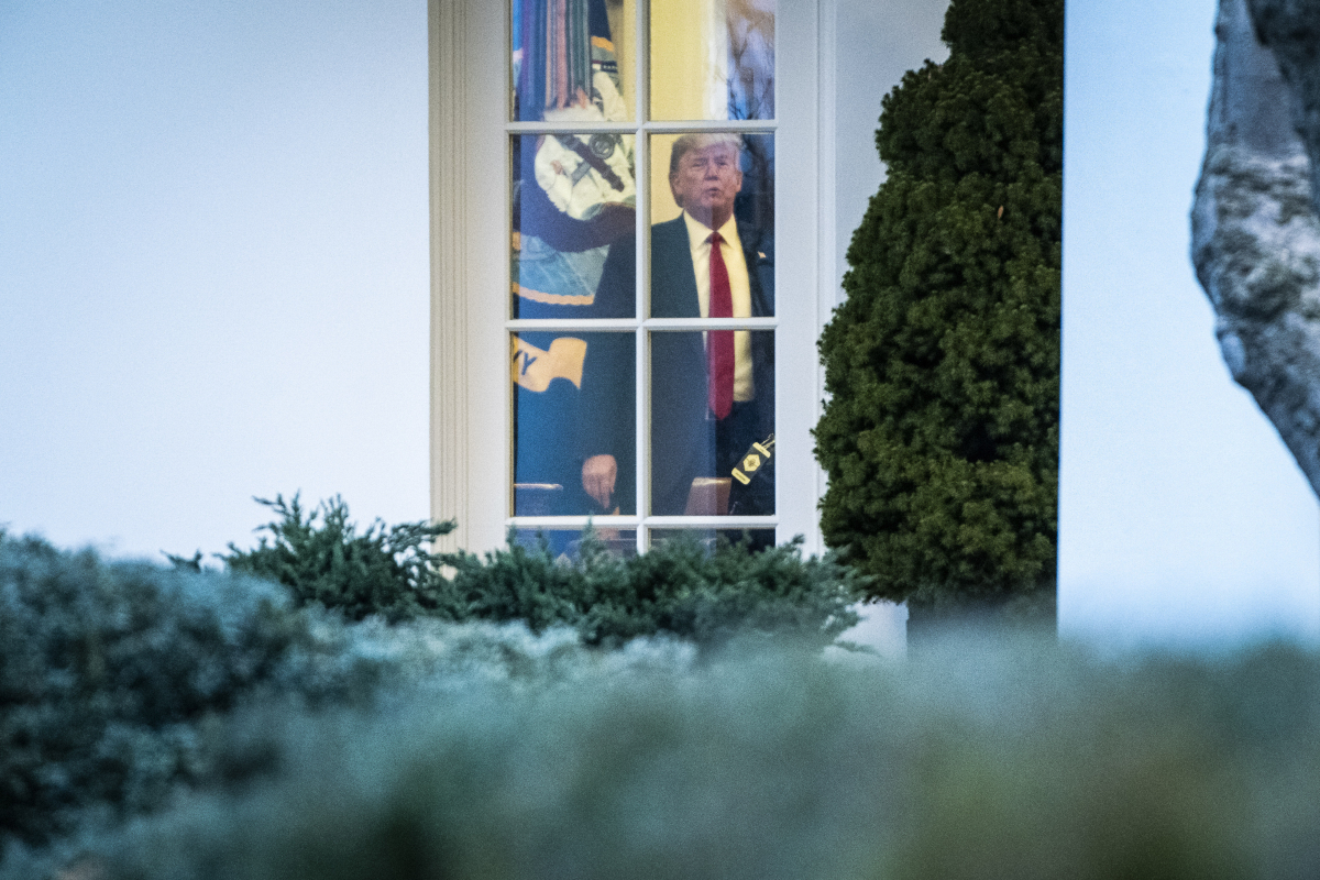President Donald Trump walks around the Oval Office before boarding Marine One on Friday. MUST CREDIT: Washington Post photo by Jabin Botsford
