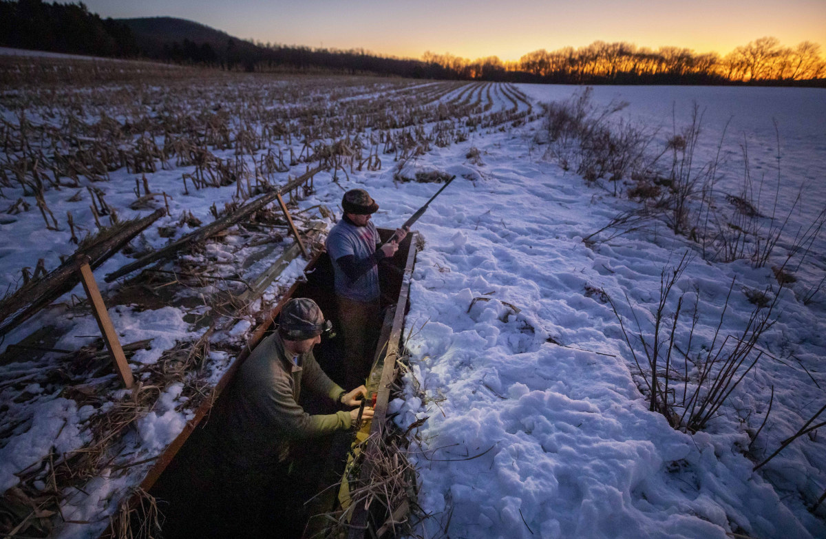 Nick Semanco, left, and Adam Saurazas set up their blind in the Middle Creek Wildlife Management Area in Stevens, Pennsylvania, on Jan. 9, 2020. MUST CREDIT: Photo for The Washington Post by Kyle Grantham