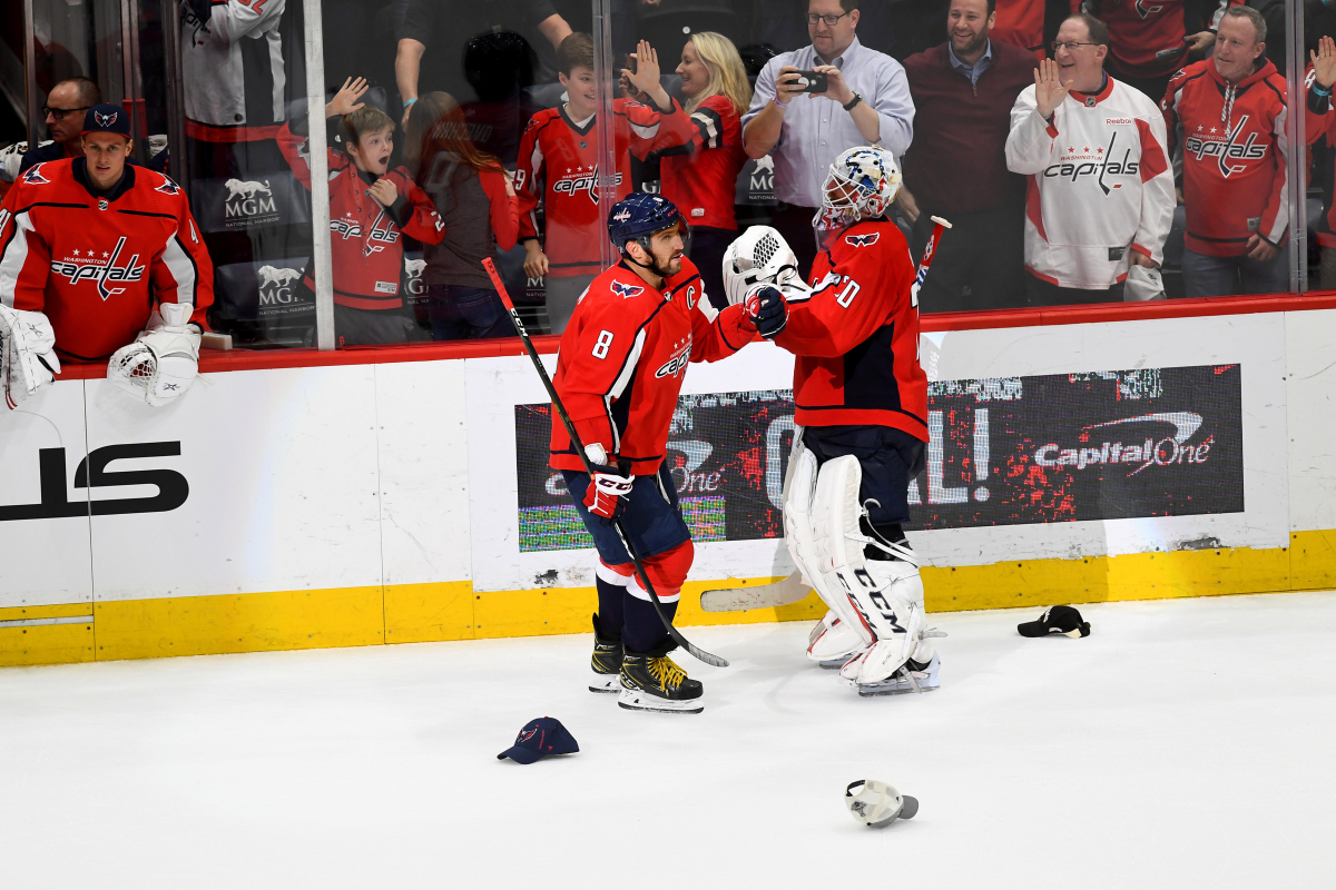 Washington Capitals left wing Alex Ovechkin celebrates his hat trick with goalie Braden Holtby on Tuesday, Feb. 4, 2020. The Capitals defeated the Los Angeles Kings, 4-2, in Washington. MUST CREDIT: Washington Post photo by Katherine Frey
