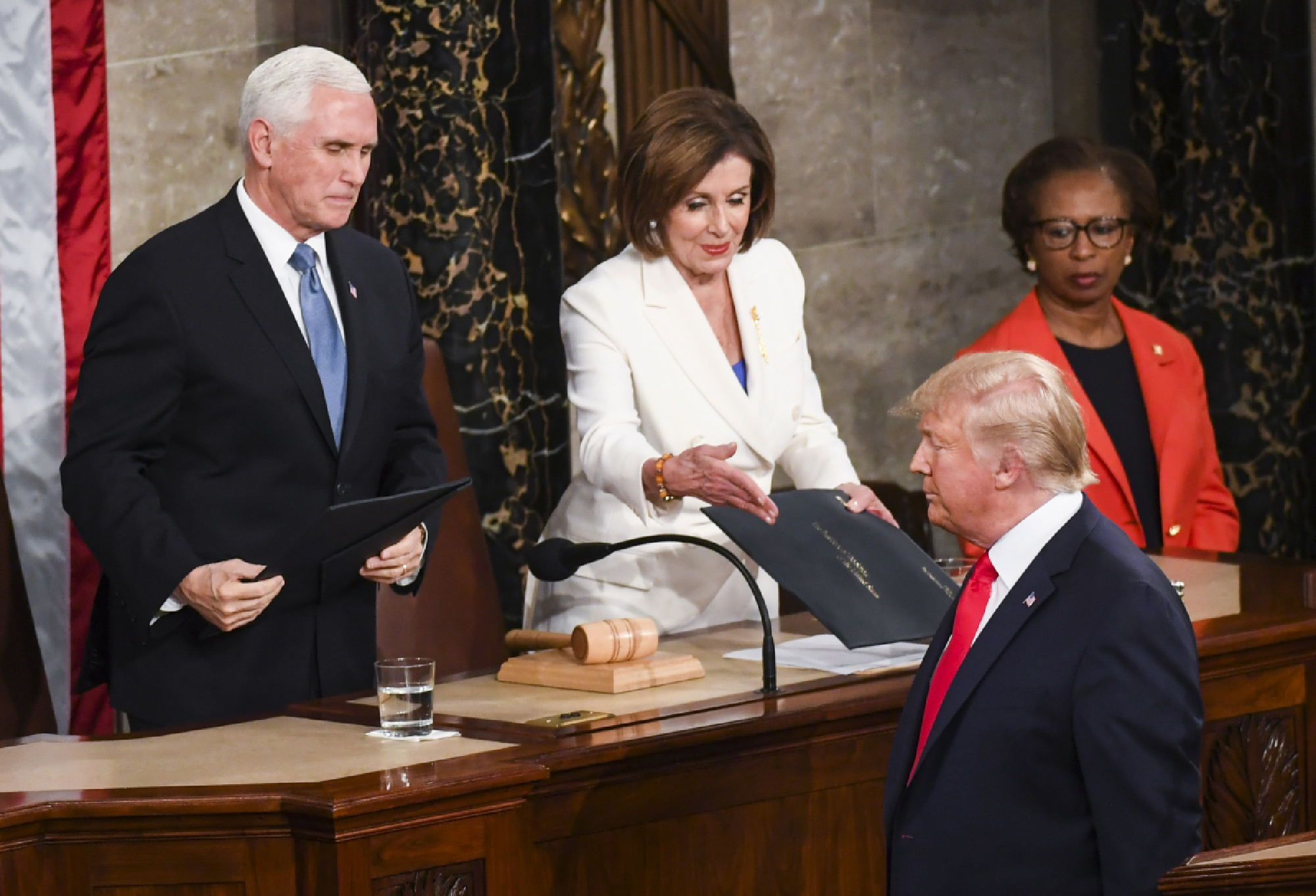 House Speaker Nancy Pelosi, D-Calif., reaches to shake President Donald Trump's hand before the State of the Union address Tuesday, Feb. 4, 2020. MUST CREDIT: Washington Post photo by Toni L. Sandys