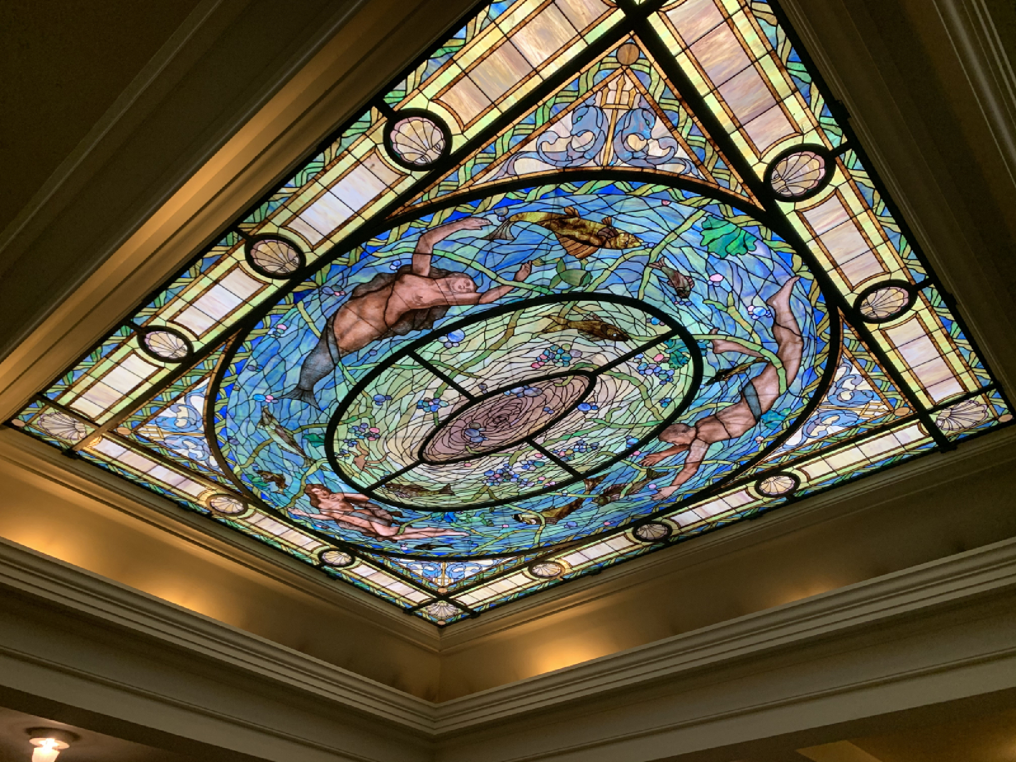 A stained-glass skylight depicts Neptune's daughter and other underwater whimsies in the men's dressing room at the Fordyce. In 1915, when the Fordyce opened, it cost a person 55 cents to take the waters-an average worker's daily salary. MUST CREDIT: Photo for The Washington Post by Christine Dell'Amore