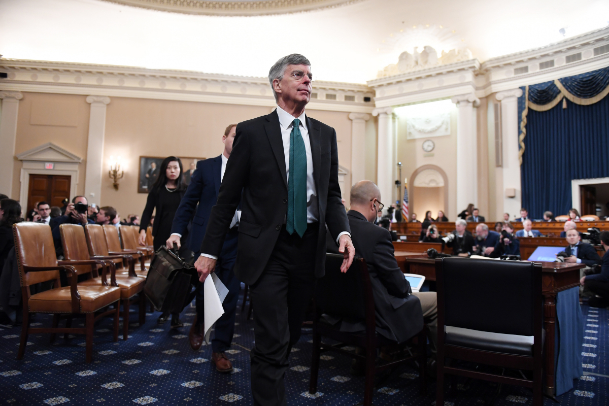 Ambassador William B. Taylor Jr. leaves an impeachment hearing after he and Deputy Assistant Secretary of State George Kent had testified. MUST CREDIT: Washington Post photo by Matt McClain.