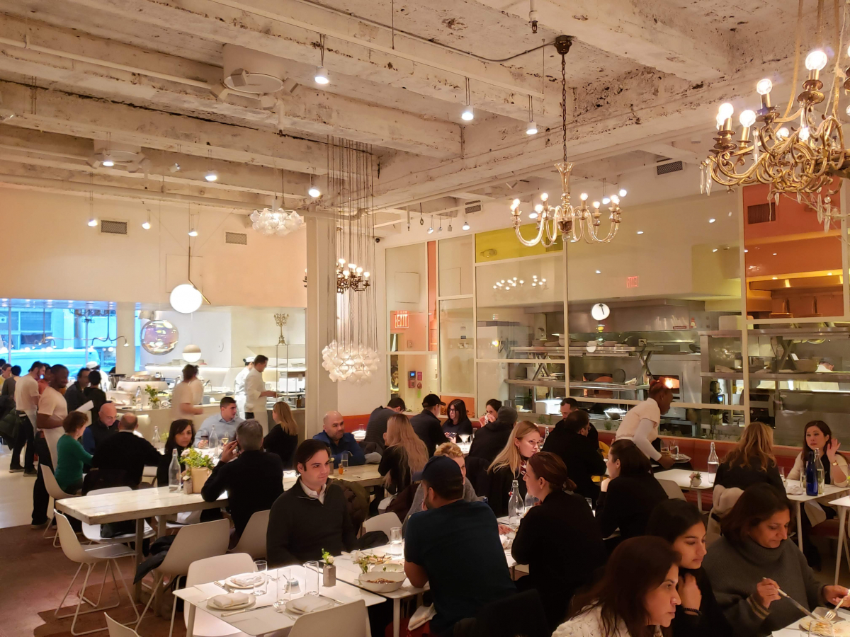 Modern design meets vintage elegance at abcV, super-chef Jean-Georges Vongerichten's vegetable-focused eatery where a glass wall separates the kitchen from the dining room. MUST CREDIT: Photo by Liza Weisstuch for The Washington Post.