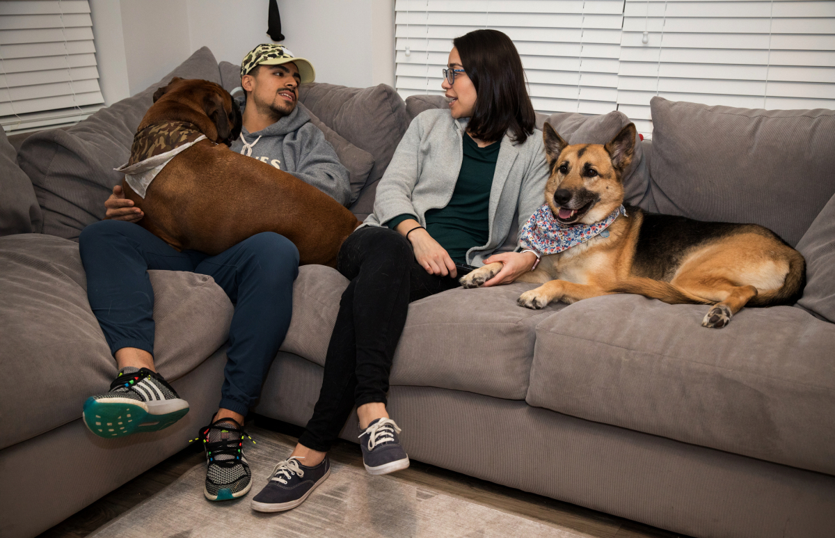 Alex and Andrea Sosias with dogs Amino, left, and Lola at home in Gaithersburg, Md., on Jan. 30, 2020. MUST CREDIT: Photo for The Washington Post by Evelyn Hockstein