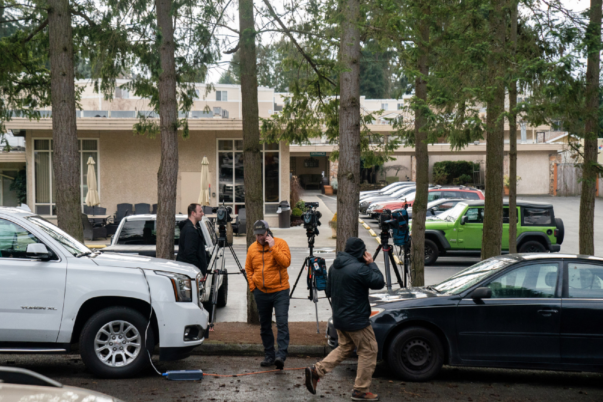 Members of the media wait outside Life Care Center nursing home on Sunday, March 1, 2020, in Kirkland, Washington, where officials are monitoring a possible coronavirus outbreak. MUST CREDIT: Photo for The Washington Post by Jovelle Tamayo