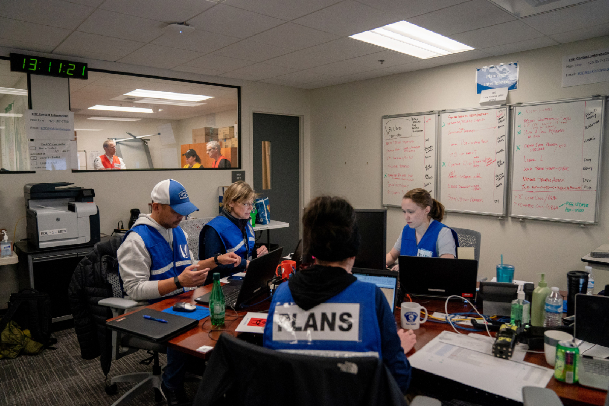 City employees work at the Kirkland, Washington, emergency outbreak center at City Hall on Sunday, March 1, 2020. MUST CREDIT: Photo for The Washington Post by Jovelle Tamayo