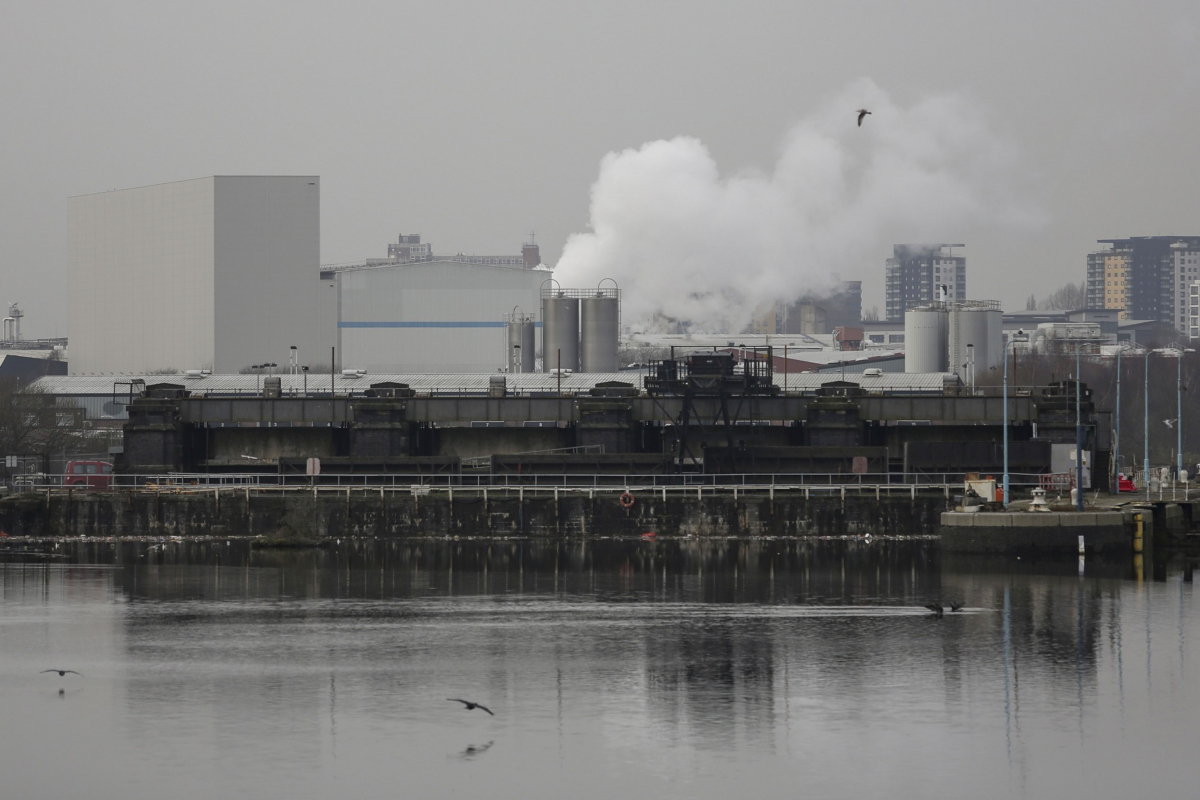 Factories operate on the banks of a river in Manchester, England, on Feb. 5, 2020. MUST CREDIT: Bloomberg photo by Paul Thomas.