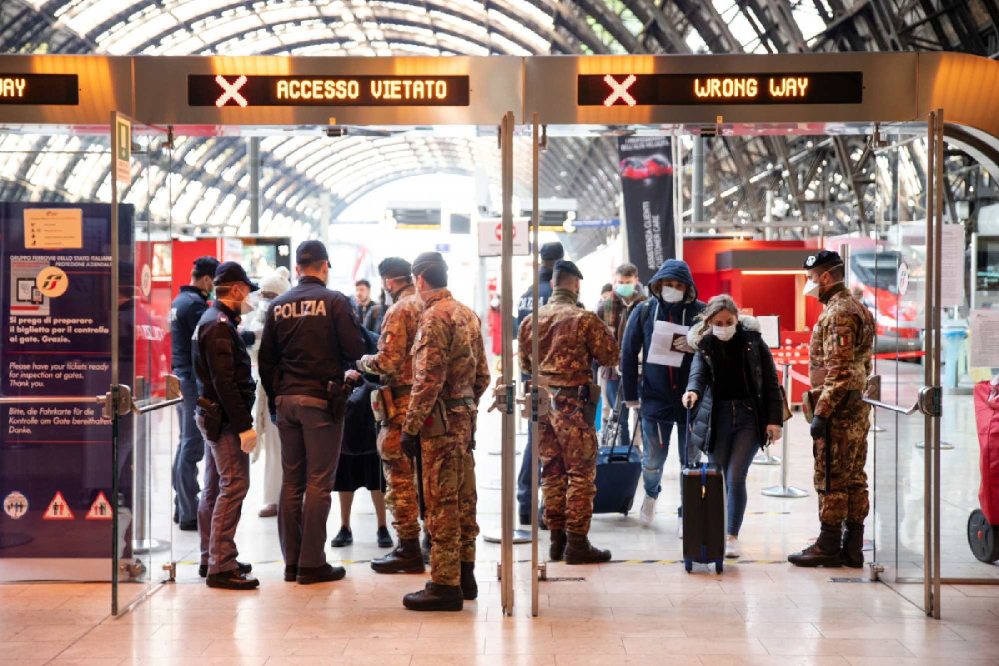 Police check commuters' travel authorization forms at Centrale railway station in Milan on March 10, 2020. MUST CREDIT: Bloomberg photo by Camilla Cerea