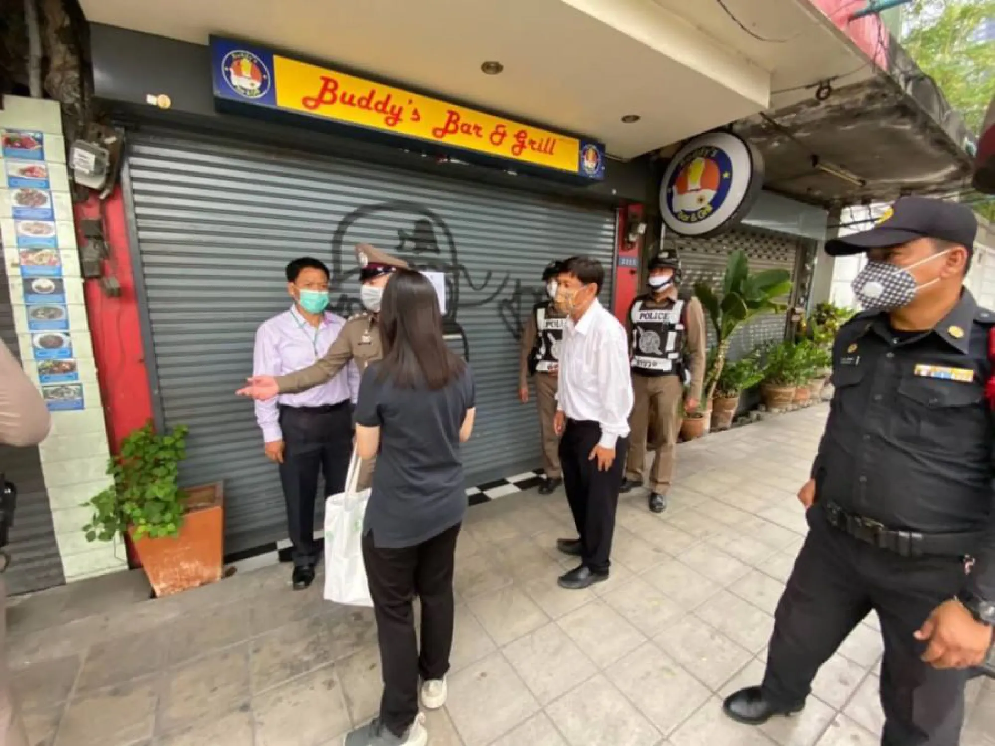 Bangkok officers check if entertainment venues heeding closure orders