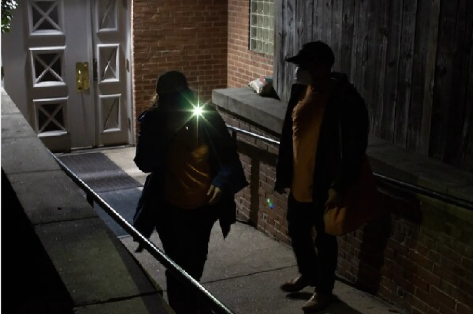Gabriel Santos and Deborah Taylor of the outreach organization Bethesda Cares search for homeless people who sleep in various areas of Silver Spring, Md, on March 17, 2020. MUST CREDIT: Photo for The Washington Post by Robb Hill