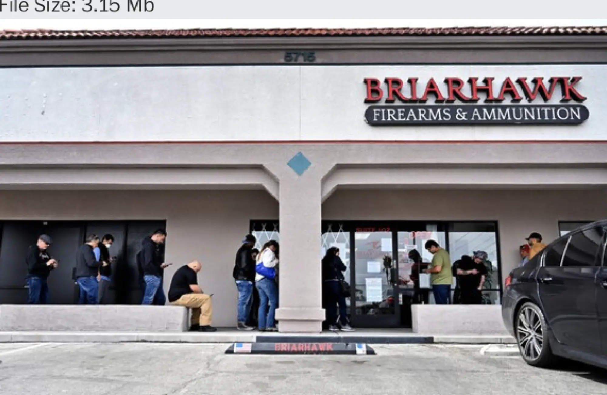 People wait in line to enter the Briarhawk Firearms and Ammunition store in Las Vegas. A sign on the door stated that only two customers were allowed inside at a time. MUST CREDIT: Photo by David Becker for The Washington Post