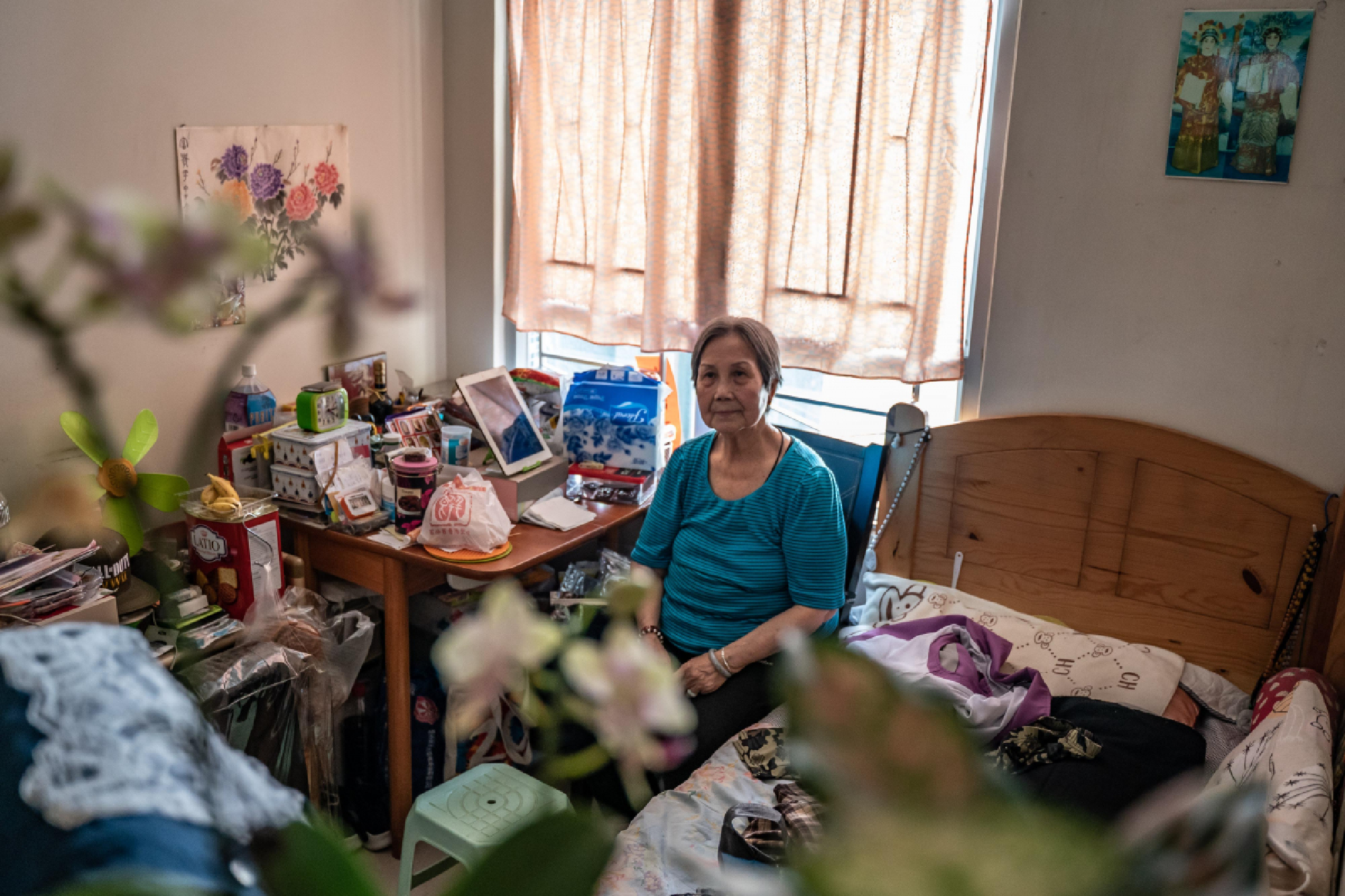 Pang Shuk-chun lives alone in a public housing. Rarely leaving her home, she survived for weeks on one bag of rice. Photo by Anthony Kwan for The Washington Post