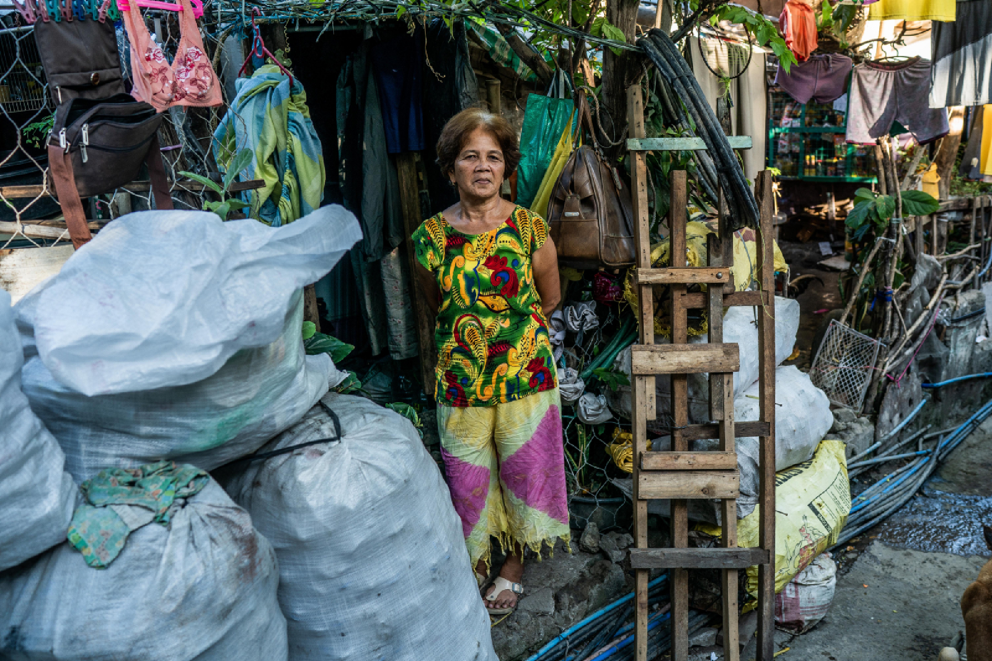 Now without work, Luisa Cabatuan and her husband scavenge for trash, which they plan to sell when junk shops reopen. Photo by Martin San Diego for The Washington Post