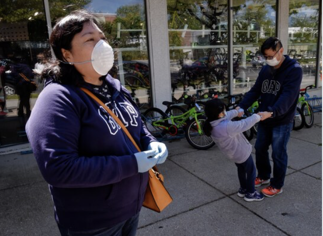 Liliana Maslog, left, purchased a new bicycle at City Bikes. MUST CREDIT: Washington Post photo by Bill O'Leary. Photo by: Bill O'Leary — The Washington Post Location: Washington United States
