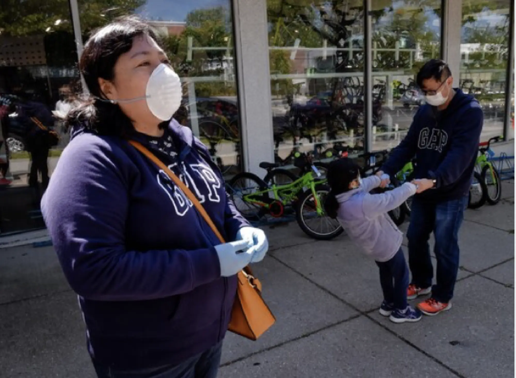 Liliana Maslog, left, purchased a new bicycle at City Bikes. MUST CREDIT: Washington Post photo by Bill O'Leary. Photo by: Bill O'Leary — The Washington Post Location: Washington United States
