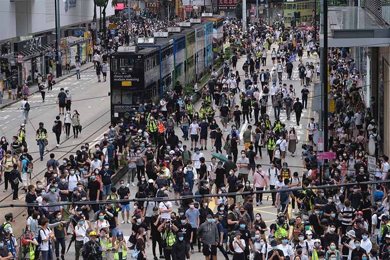 Demonstrators gather in the Causeway Bay district in Hong Kong on Sunday, May 24, 2020. MUST CREDIT: Bloomberg photo by Roy Liu