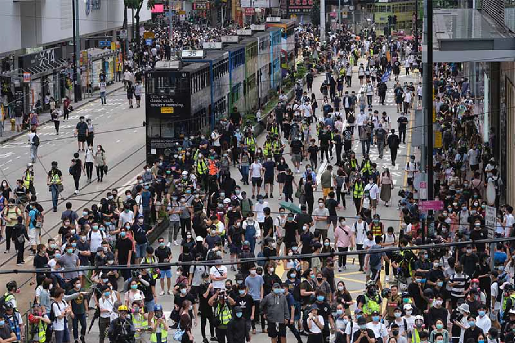 Demonstrators gather in the Causeway Bay district in Hong Kong on Sunday, May 24, 2020. MUST CREDIT: Bloomberg photo by Roy Liu