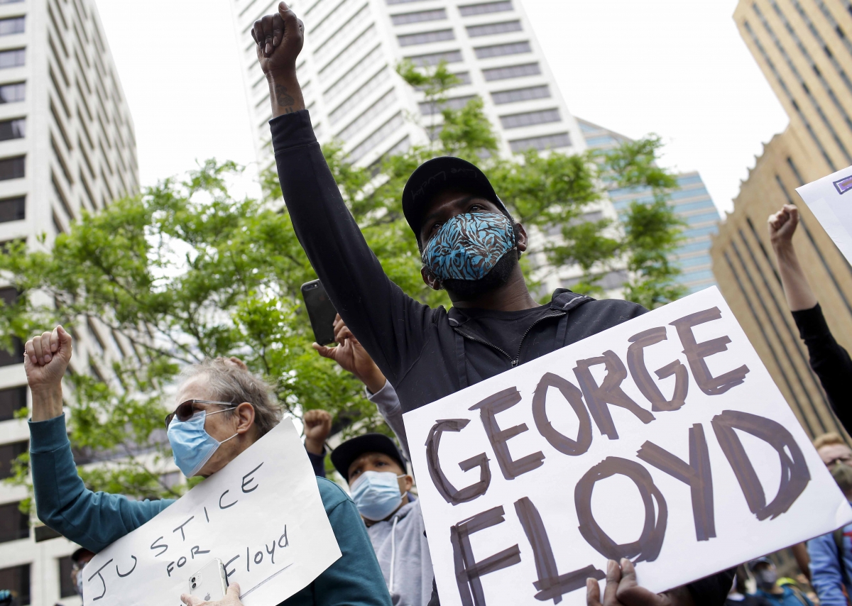 Protesters demonstrate outside the Hennepin County Government Center in Minneapolis on Friday. MUST CREDIT: Photo by Joshua Lott for The Washington Post