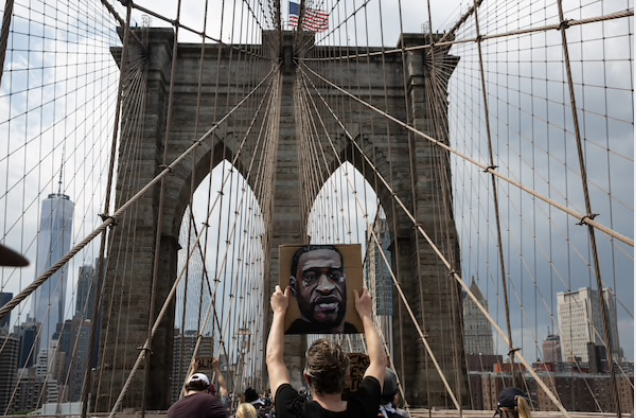 Thousands of protesters gathered in Brooklyn for a march across Brooklyn Bridge to New York City Hall on Saturday. MUST CREDIT: Photo by Holly Pickett for The Washington Post