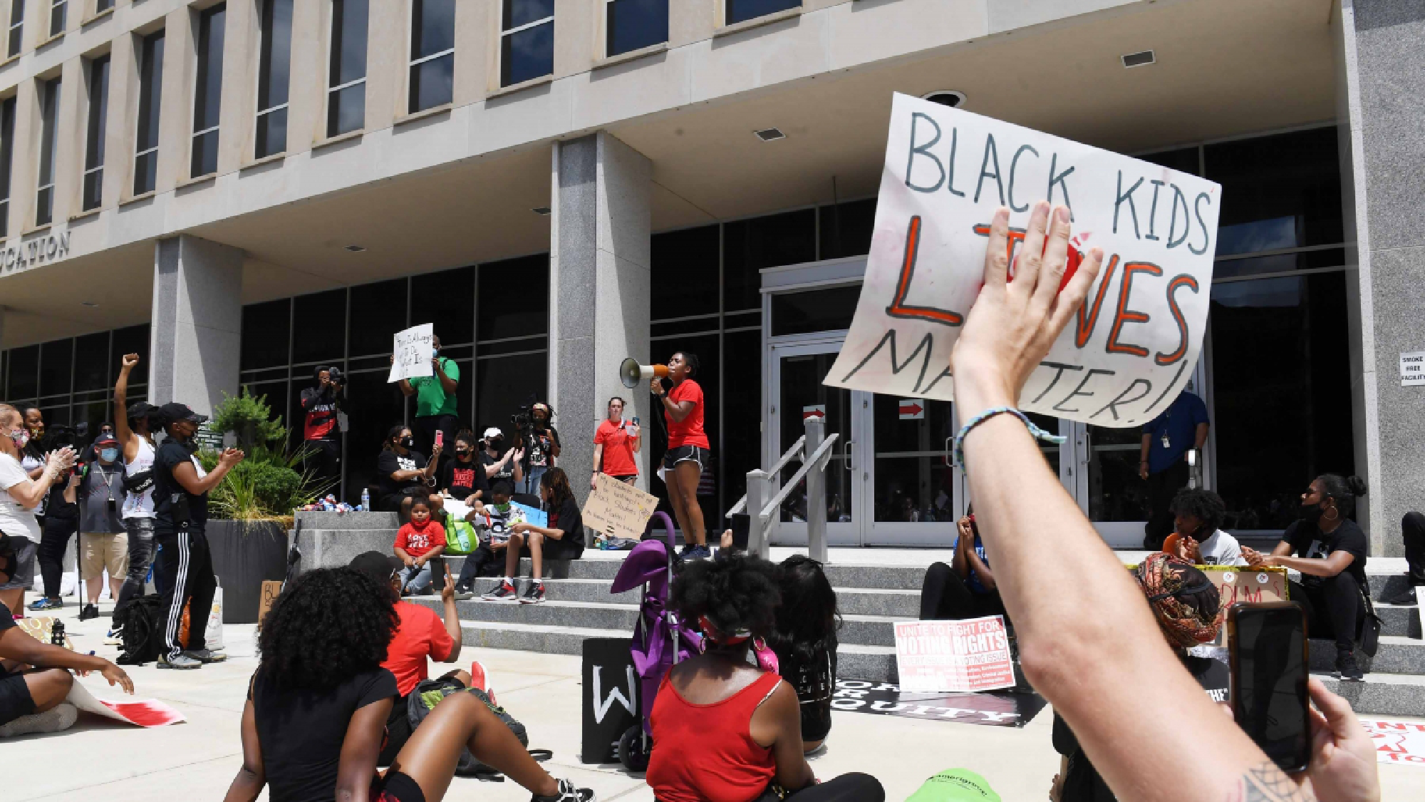 Demonstrators outside the Education Department on Friday. MUST CREDIT: Washington Post photo by Matt McClain.