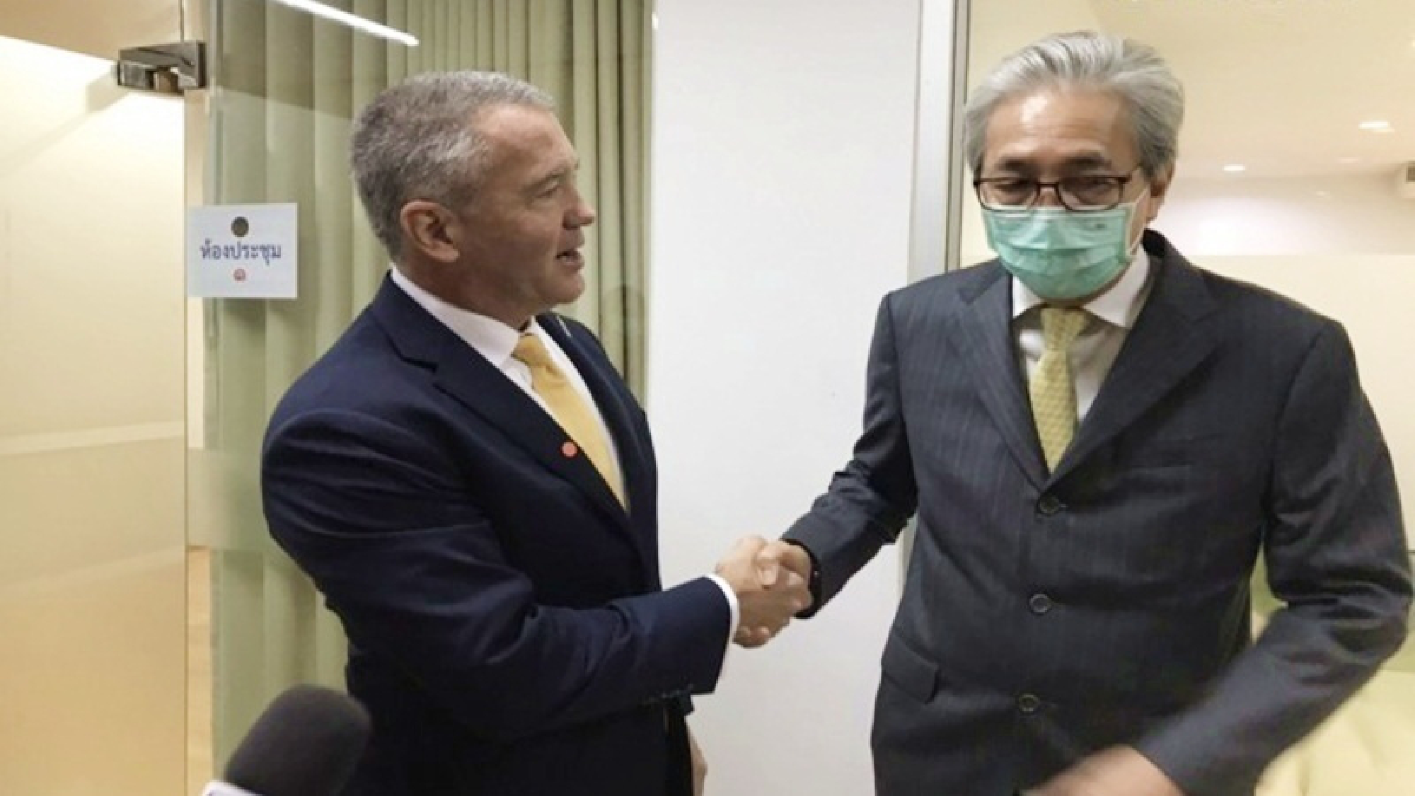 Michael George DeSombre (left) and Somkid (right)