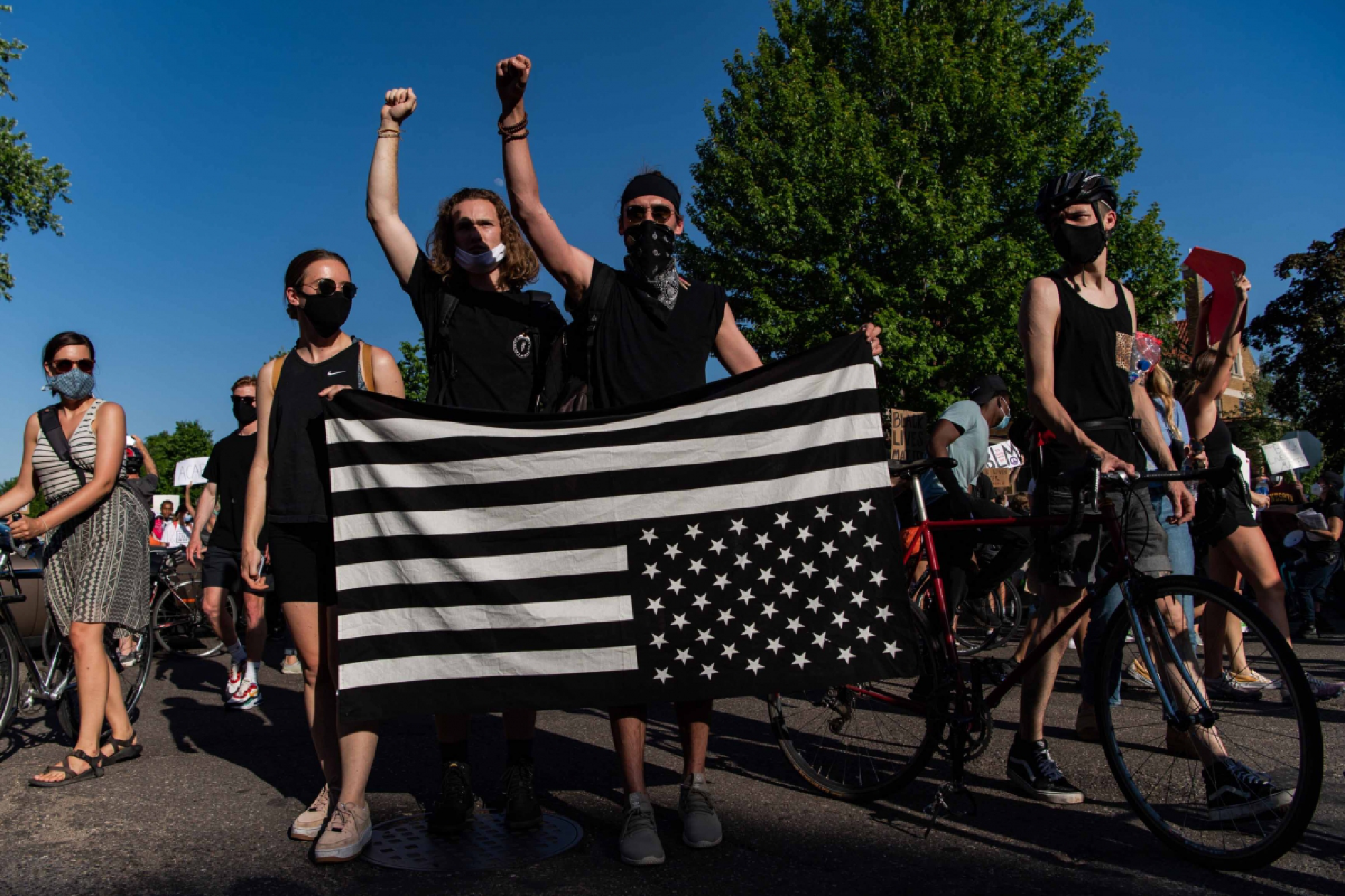 Protesters holding an American flag upside-down march in front of Minnesota Governor's Residence on Monday, June 1, 2020, in Saint Paul, Minn. MUST CREDIT: Washington Post photo by Salwan Georges