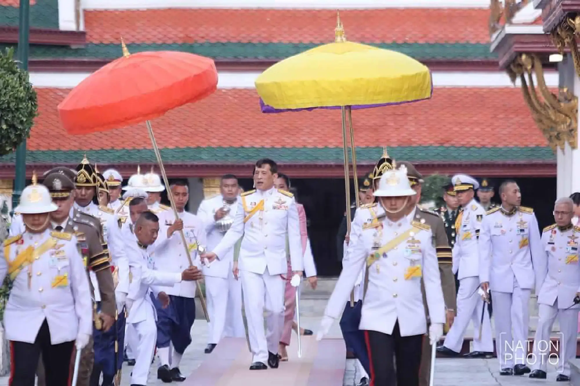 Their Majesties change Emerald Buddha attire to signal wet season