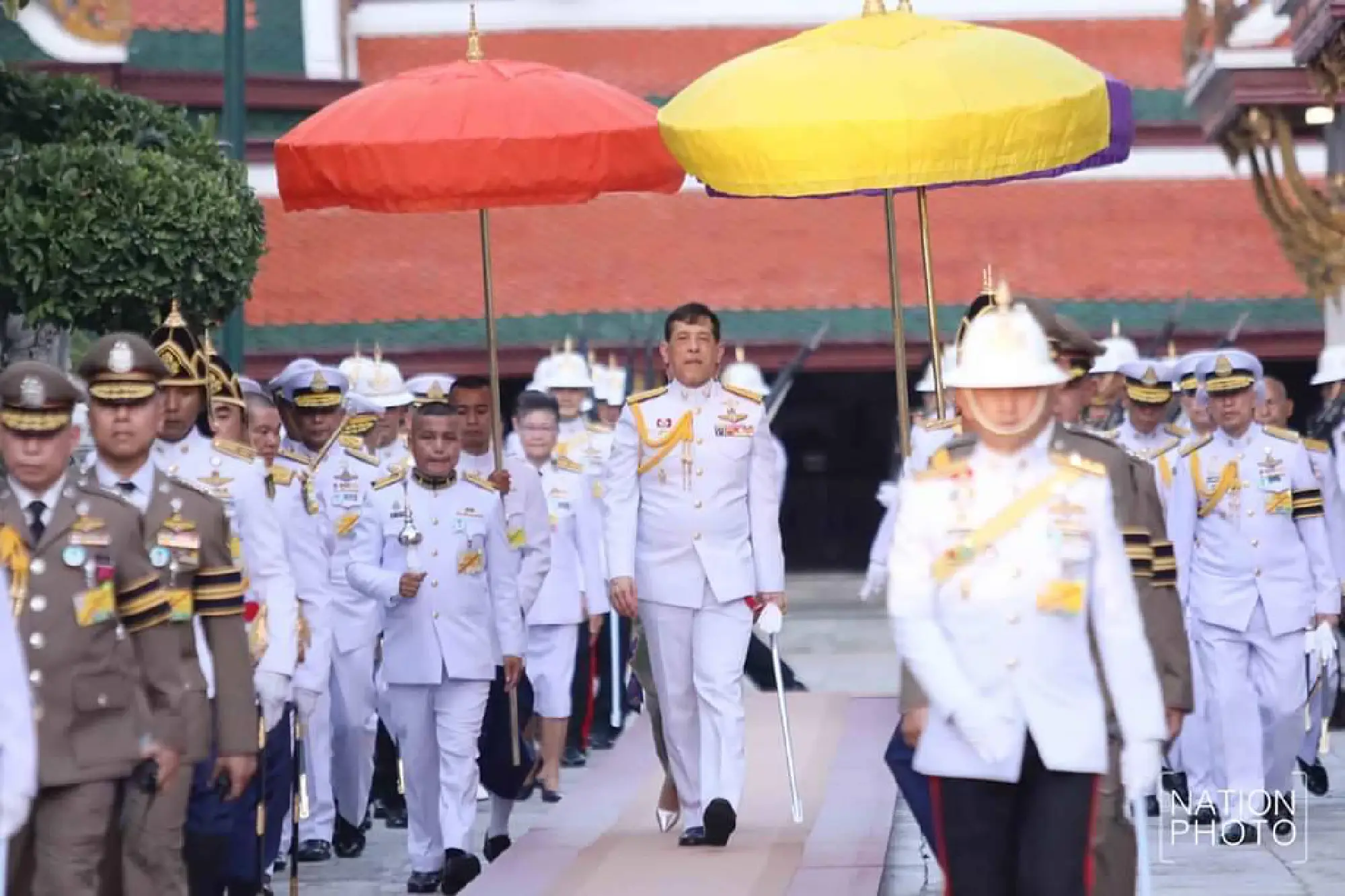 Their Majesties change Emerald Buddha attire to signal wet season