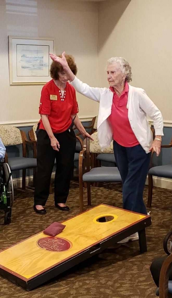 Jane Daych, 91, is the reigning cornhole champion at her assisted-living facility, the Hearth at Tuxis Pond, in Madison, Conn. MUST CREDIT: Kathy True