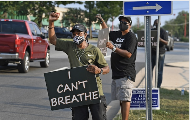 Louis Harper, left, leads a protest in front of the Fish Market restaurant in Clinton, Md., on July 7, 2020. MUST CREDIT: Washington Post photo by Michael S. Williamson