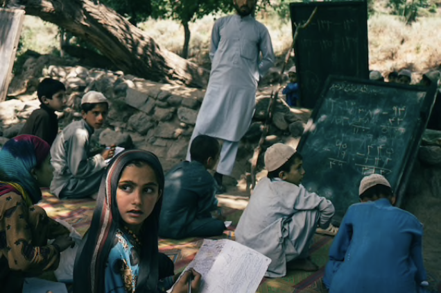 Children attend school in Marawara district, Afghanistan, on July 6, 2020. MUST CREDIT: Photo for The Washington Post by Lorenzo Tugnoli