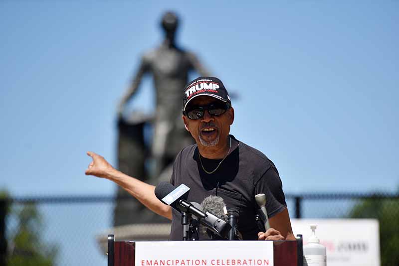 Mason Weaver, of St. Louis, speaks Tuesday at a rally in support of the Emancipation Memorial in the District. Critics have said the monument, which depicts Abraham Lincoln standing over a kneeling formerly enslaved man, is demeaning toward African Americans. MUST CREDIT: Washington Post photo by Marvin Joseph