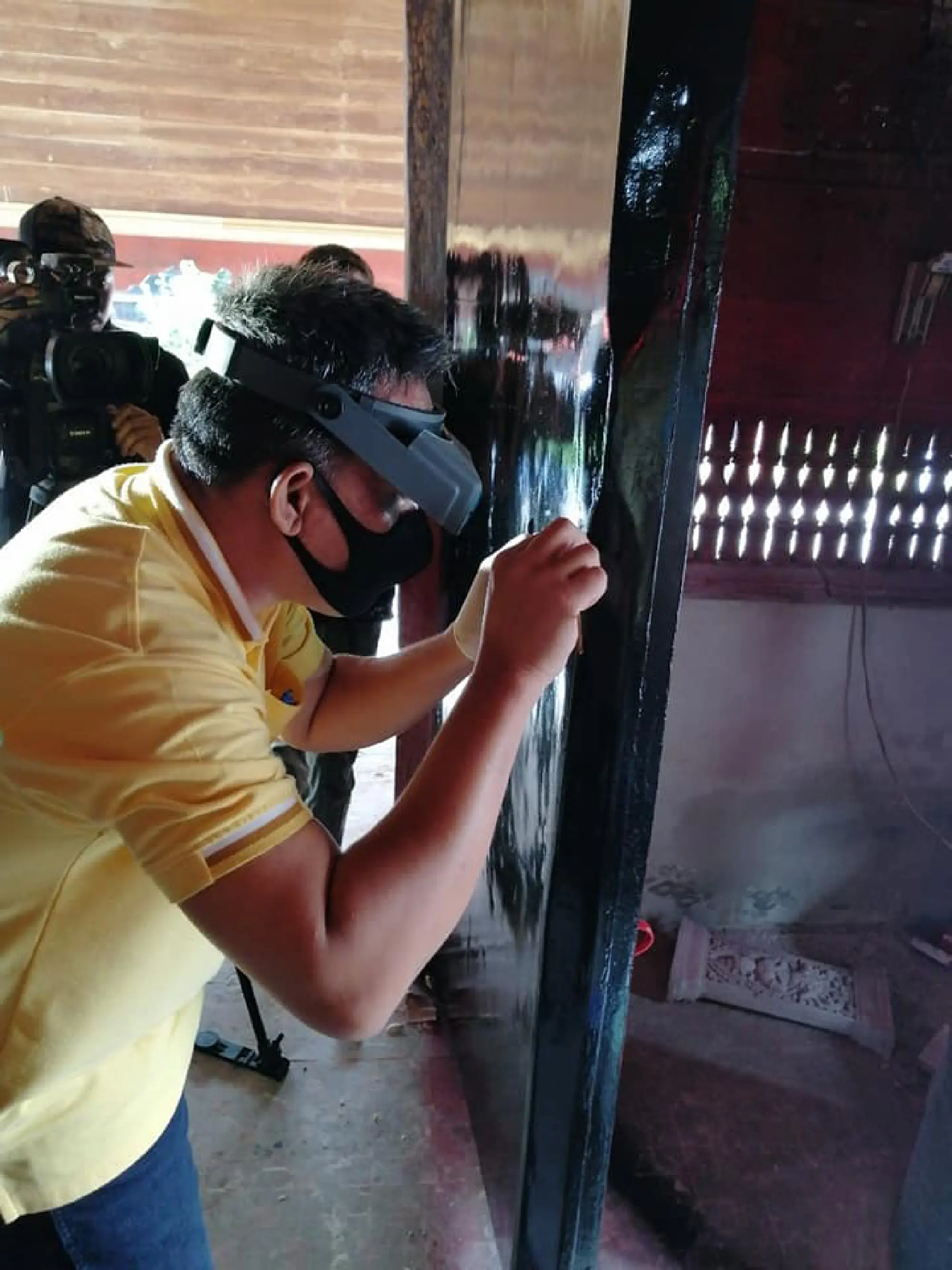 Stripping ancient temple doors of resin, paint ‘will not be easy’